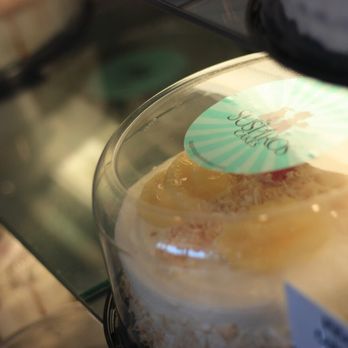 Suspiros Cakes - a cupcake in a glass case - Desserts Near Me - Tucson, Arizona Suspiros Cakes - a cupcake in a glass case - Desserts Near Me - Tucson, Arizona