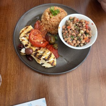 Halibut with olives & tomatoes, dirty rice & black-eyed pea salad