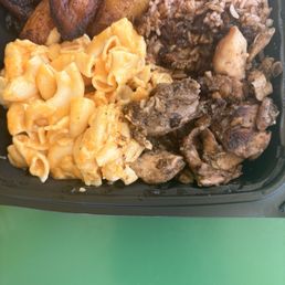 Mac & cheese, beans and rice, jerk, chicken, and plantains Mac & cheese, beans and rice, jerk, chicken, and plantains