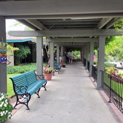 Oakpark Healthcare Center - The front walkway covered by a trellis of wisteria.