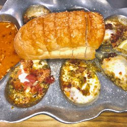 Sammy's Grill - Roughneck Oysters -
Cream cheese, jalapeño & bacon with our oyster butter