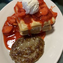 Rustic Roost - Stuffed Strawberry Waffle with Sausage ($18.95) with a glass of fresh Tetzners Milk ($3.95)