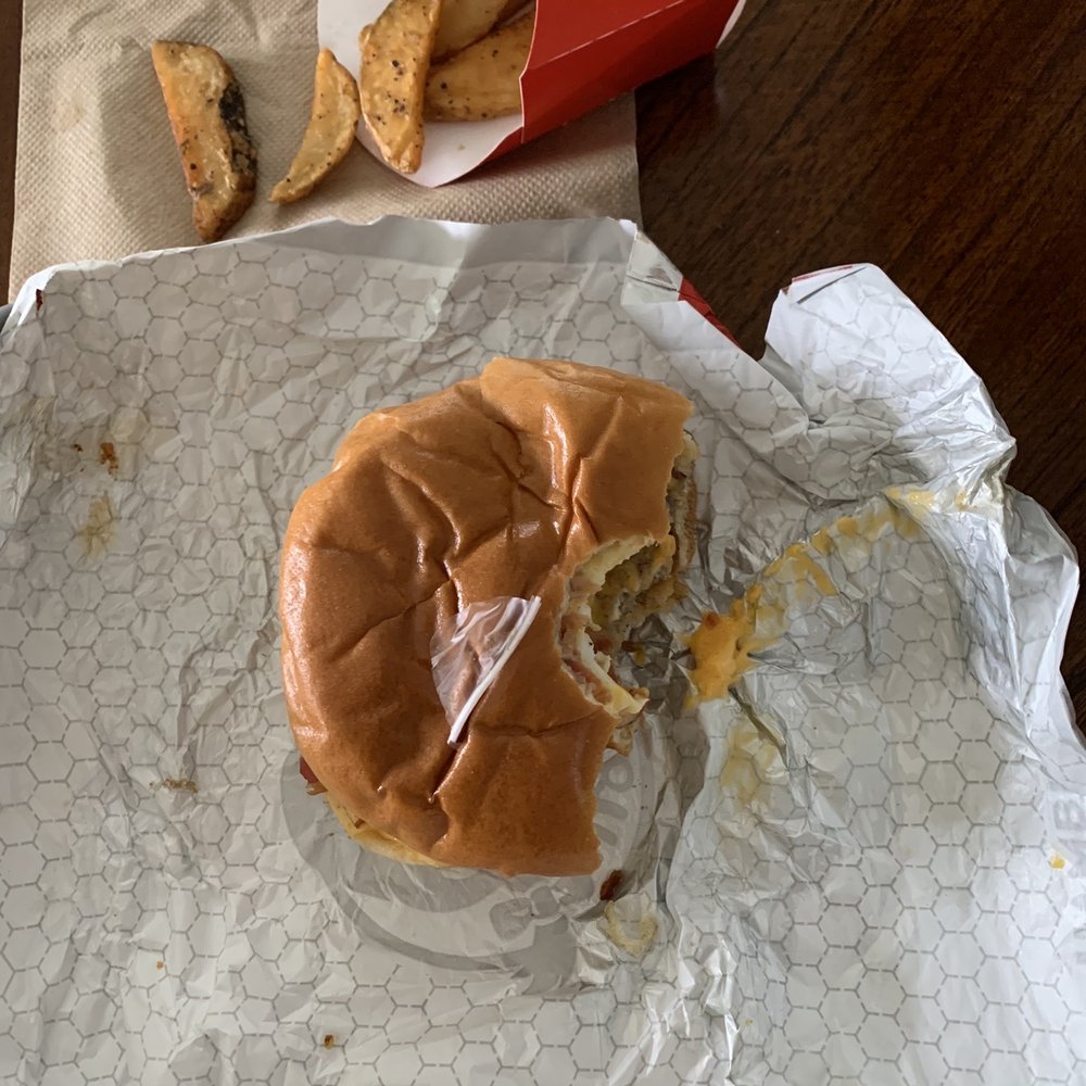 Wendy's - a half eaten hamburger and fries - Fast Food Near Me - Hampstead, North Carolina Wendy's - a half eaten hamburger and fries - Fast Food Near Me - Hampstead, North Carolina