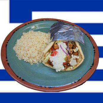 The Greek Taco - Mediterranean Chicken served on warmed pita with lettuce, 
Roma tomato, red onion, tzatziki and feta cheese with a side of Greek Rice - Greek Near Me - Onalaska, Texas