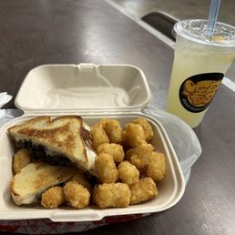 Maple bacon grilled cheese with seasoned tots and a lemonade. One of the best GC Ive ever had! Maple bacon grilled cheese with seasoned tots and a lemonade. One of the best GC Ive ever had!