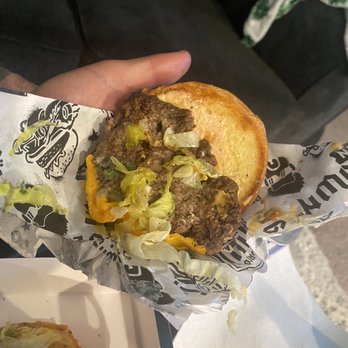 Guy Fieri's Flavortown Kitchen - Burger patty only fit half of the bun - Food Delivery Services Near Me Guy Fieri's Flavortown Kitchen - Burger patty only fit half of the bun - Food Delivery Services Near Me