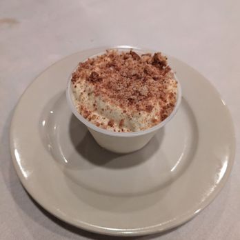 Piccolo's - Rum Infused Cream with Almond Crumbs - Italian Near Me - Mineola, New York Piccolo's - Rum Infused Cream with Almond Crumbs - Italian Near Me - Mineola, New York