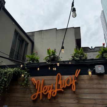 Hey Lucy - Hey Lucy sign on the rooftop - Pizza Near Me - Toronto, Ontario