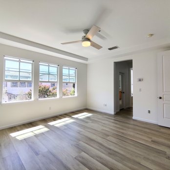Gregory's Floors - a large empty room with a ceiling fan - Flooring Near Me - San Rafael, California Gregory's Floors - a large empty room with a ceiling fan - Flooring Near Me - San Rafael, California