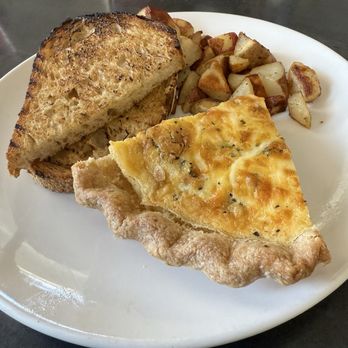 Blue Willow Restaurant & Gift Shop - Quiche if the day with breakfast potatoes and sourdough toast - New American Near Me - Tucson, Arizona