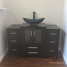 Old vanity gone new one installed along with flooring and trim Old vanity gone new one installed along with flooring and trim