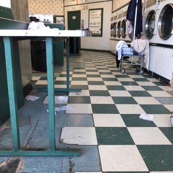 Kwik Wash Laundry - Lots of unclaimed clothes in baskets and in washers - Laundromat Near Me - San Antonio, Texas