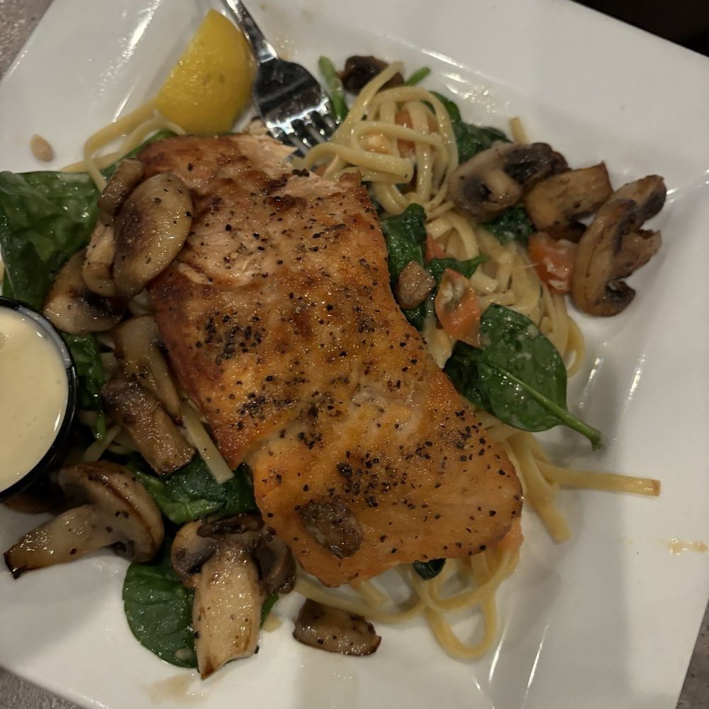 This was the salmon special with mushrooms. It had a delicious sauce on the side. This was the salmon special with mushrooms. It had a delicious sauce on the side.