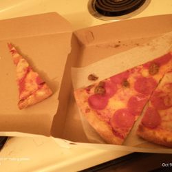 Ciao Bella Pizza and Pasta - Pepperoni & sausage and a slice of pepperoni. I cut tiny triangles off for myself Roommates gets bigger slices. Perfect Pizza.