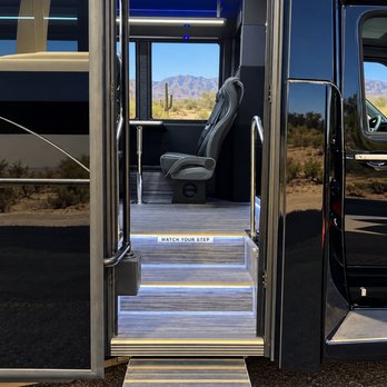 Tribute Transportation - Extended shuttle entrance with illuminated steps and handrails. - Town Car Service Near Me Tribute Transportation - Extended shuttle entrance with illuminated steps and handrails. - Town Car Service Near Me