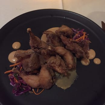 The Carillon - Chicken fried quail, perfect crispness and paired with some sort of sweet peach sauce. Amazing combination of flavors. - New American Near Me - Austin, Texas