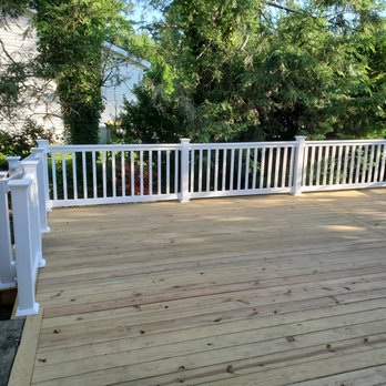 JW Tull Contracting - a deck with white railings - General Contractors Near Me - Wilmington, Delaware