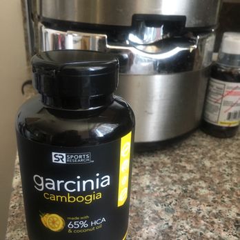 GNC - a jar of garcinia next to a slow juicer - Vitamins & Supplements Near Me - North Hollywood, California