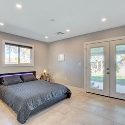 We Build It - Fully remodeled master bedroom - large format tile flooring, recessed LED lighting, new window, new French doors