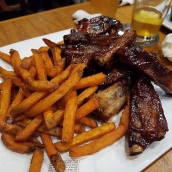 CJ's Brewing Company - Ribs come with choice of 2 sides. Sweet potato fries shown here. - Pizza Near Me - Commerce Twp, Michigan CJ's Brewing Company - Ribs come with choice of 2 sides. Sweet potato fries shown here. - Pizza Near Me - Commerce Twp, Michigan