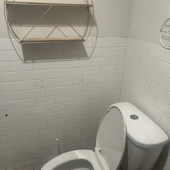 Korny Vibes - Bathroom with weird hole in the wall - Vegan Near Me - Houston, Texas Korny Vibes - Bathroom with weird hole in the wall - Vegan Near Me - Houston, Texas