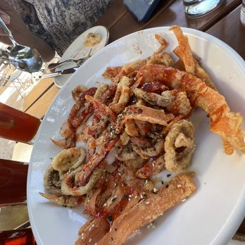Agustin Kitchen - Overcooked calamari seasoned with a Sriracha flavored tone. - New American Near Me - Tucson, Arizona