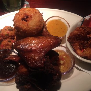 Bahama Breeze - The Island Hopper: jerk chicken, conch fritters, friend onion wings, and coconut shrimp. - Seafood Near Me - Cherry Hill, New Jersey