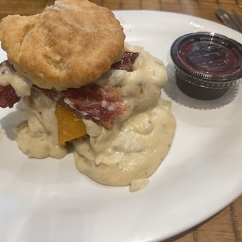 Maple Street Biscuit Cafe - Five and Dime, sans egg. Berry jam on the side. Sausage gravy I have no business having. Note the bite in my haste and greed. Sublime. - Breakfast & Brunch Near Me - St Petersburg, Florida