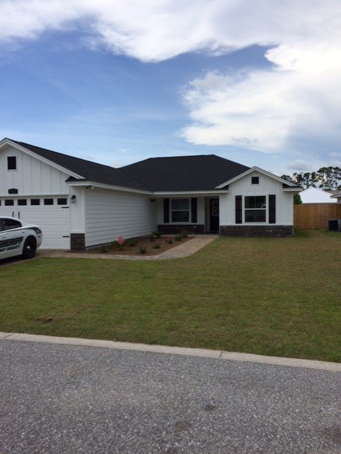 Slide of Greg's Roofing Of Bay County