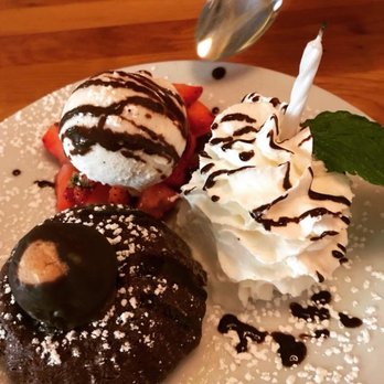Basi Italia - Chocolate Souffle Cake with Housemade Whipped Cream, Vanilla Bean Gelato, and a buckeye. (Plus, a candle for our anniversary.) - Italian Near Me - Columbus, Ohio Basi Italia - Chocolate Souffle Cake with Housemade Whipped Cream, Vanilla Bean Gelato, and a buckeye. (Plus, a candle for our anniversary.) - Italian Near Me - Columbus, Ohio