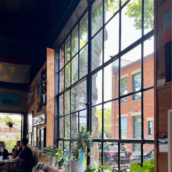 Cru Cafe - Interior: big nice windows with plants - Breakfast & Brunch Near Me - Newport, Rhode Island Cru Cafe - Interior: big nice windows with plants - Breakfast & Brunch Near Me - Newport, Rhode Island