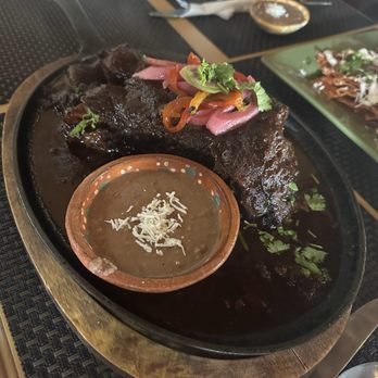 Allea - My Chamorro and refried beans side view. A must try if you like mole. Tasted like mole poblano. So tender too - Buffets Near Me - Ensenada, BCN Allea - My Chamorro and refried beans side view. A must try if you like mole. Tasted like mole poblano. So tender too - Buffets Near Me - Ensenada, BCN
