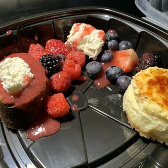 The Capital Grille - Anniversary dessert to go - creme brûlée cheesecake and chocolate mousse tart with berries - Steakhouses Near Me - Troy, Michigan