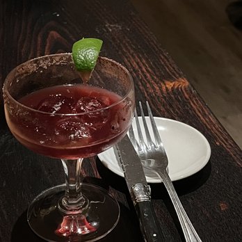 The Waxwing - a glass of wine with a lime garnish - Mediterranean Near Me - Hatfield, Massachusetts The Waxwing - a glass of wine with a lime garnish - Mediterranean Near Me - Hatfield, Massachusetts