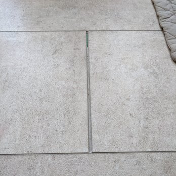 My Affordable Flooring - Kitchen floor tiles moving apart from each other creating a gap. - Flooring Near Me - Sturtevant, Wisconsin