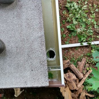 Maynard Roofing - Shot from roof top of new downspout at end of 30ft seamless gutter - Roofing Near Me - Watertown, Connecticut Maynard Roofing - Shot from roof top of new downspout at end of 30ft seamless gutter - Roofing Near Me - Watertown, Connecticut