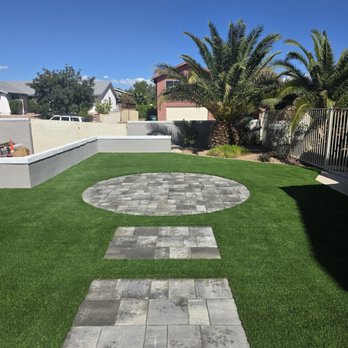 Mad Turf Installations - Artificial turf with a walkway to a circular pad made with pavers. - Landscaping Near Me - Las Vegas, Nevada Mad Turf Installations - Artificial turf with a walkway to a circular pad made with pavers. - Landscaping Near Me - Las Vegas, Nevada