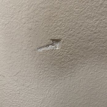 Hulk Movers - Hole on the wall of our staircase. - Movers Near Me - San Diego, California Hulk Movers - Hole on the wall of our staircase. - Movers Near Me - San Diego, California