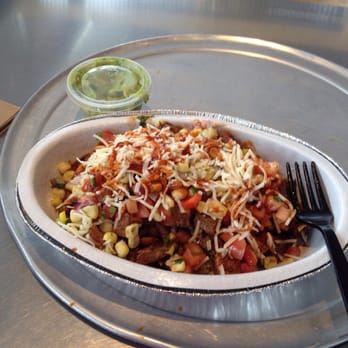 Chipotle Mexican Grill - Steak Burrito Bowl with corn salsa, pico de gallo, cheese, chipotle tobasco sauce, and guacamole on the side. 04/22/14 - Mexican Near Me - Pueblo, Colorado Chipotle Mexican Grill - Steak Burrito Bowl with corn salsa, pico de gallo, cheese, chipotle tobasco sauce, and guacamole on the side. 04/22/14 - Mexican Near Me - Pueblo, Colorado