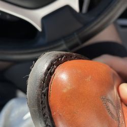 Tony's Shoe Repair - Missed stitching and sliced toe box from the stitching misalignment.