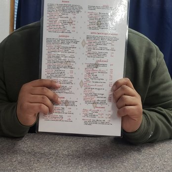 Express Cafe - a man holding up a menu - Breakfast & Brunch Near Me - Meridian, Idaho Express Cafe - a man holding up a menu - Breakfast & Brunch Near Me - Meridian, Idaho