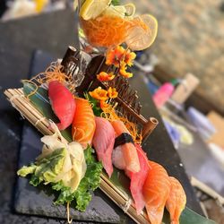Hokkaido Grill & Sushi - Sushi regular with California roll (behind it