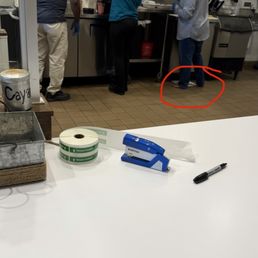 Employee making food barefoot. Employee making food barefoot.