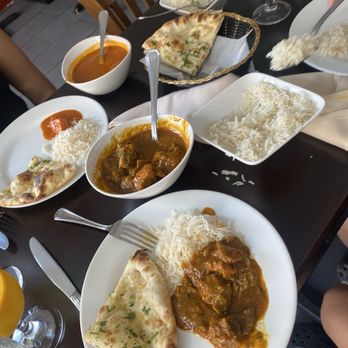 India House Restaurant - Garlic nann bread, rice, lower left goat curry and upper left is chicken Chicken Tikka Masala - Indian Near Me - Brooklyn, New York India House Restaurant - Garlic nann bread, rice, lower left goat curry and upper left is chicken Chicken Tikka Masala - Indian Near Me - Brooklyn, New York
