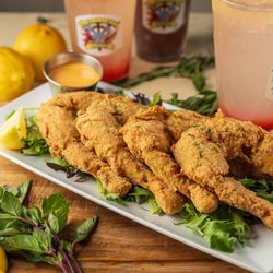 Mighty Good Seafood - Crispy fried frog legs paired with a refreshing signature drink--bold Southern flavor, perfect vibes, and unforgettable taste.