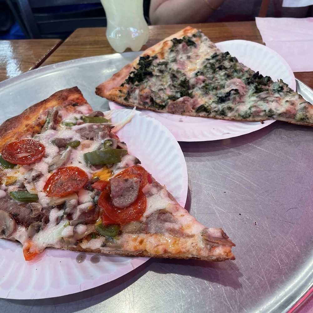 Mezza Luna Pizza - The lineup: broccoli rabe & sausage + a fully loaded specialty slice - Pizza Near Me - Bronx, New York Mezza Luna Pizza - The lineup: broccoli rabe & sausage + a fully loaded specialty slice - Pizza Near Me - Bronx, New York