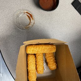 Half container of marinara sauce.