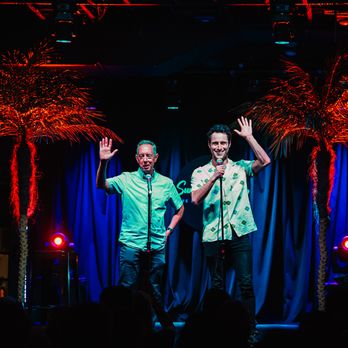 Sunset Strip - two men on stage waving - Comedy Clubs Near Me - Austin, Texas Sunset Strip - two men on stage waving - Comedy Clubs Near Me - Austin, Texas