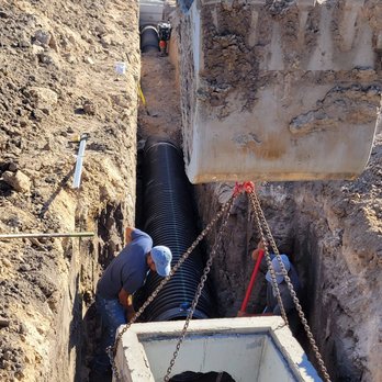 Allied Exterior - a man working on a trench - Masonry/Concrete Near Me Allied Exterior - a man working on a trench - Masonry/Concrete Near Me