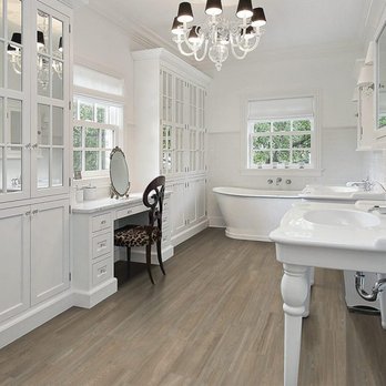 Flooring Liquidators - Hamilton - a white bathroom with a chandelier - Flooring Near Me - Hamilton, Ontario